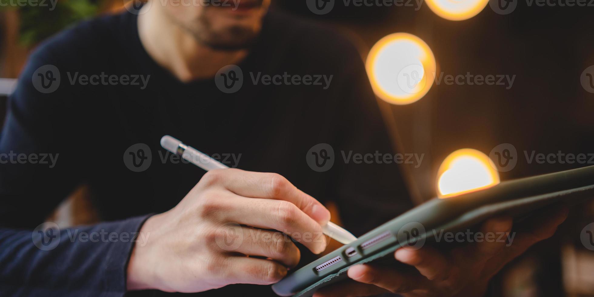 using professional digital tablet technology to write a business work, modern online screen cyberspace communication, hand writing via white pen, lifestyle same laptop computer or notebook using photo