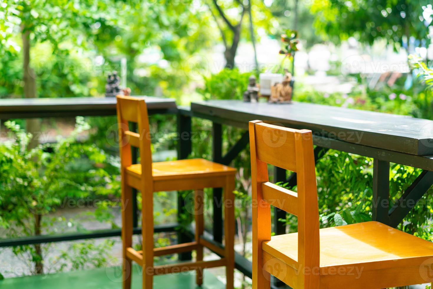 empty wooden bar stool in garden photo