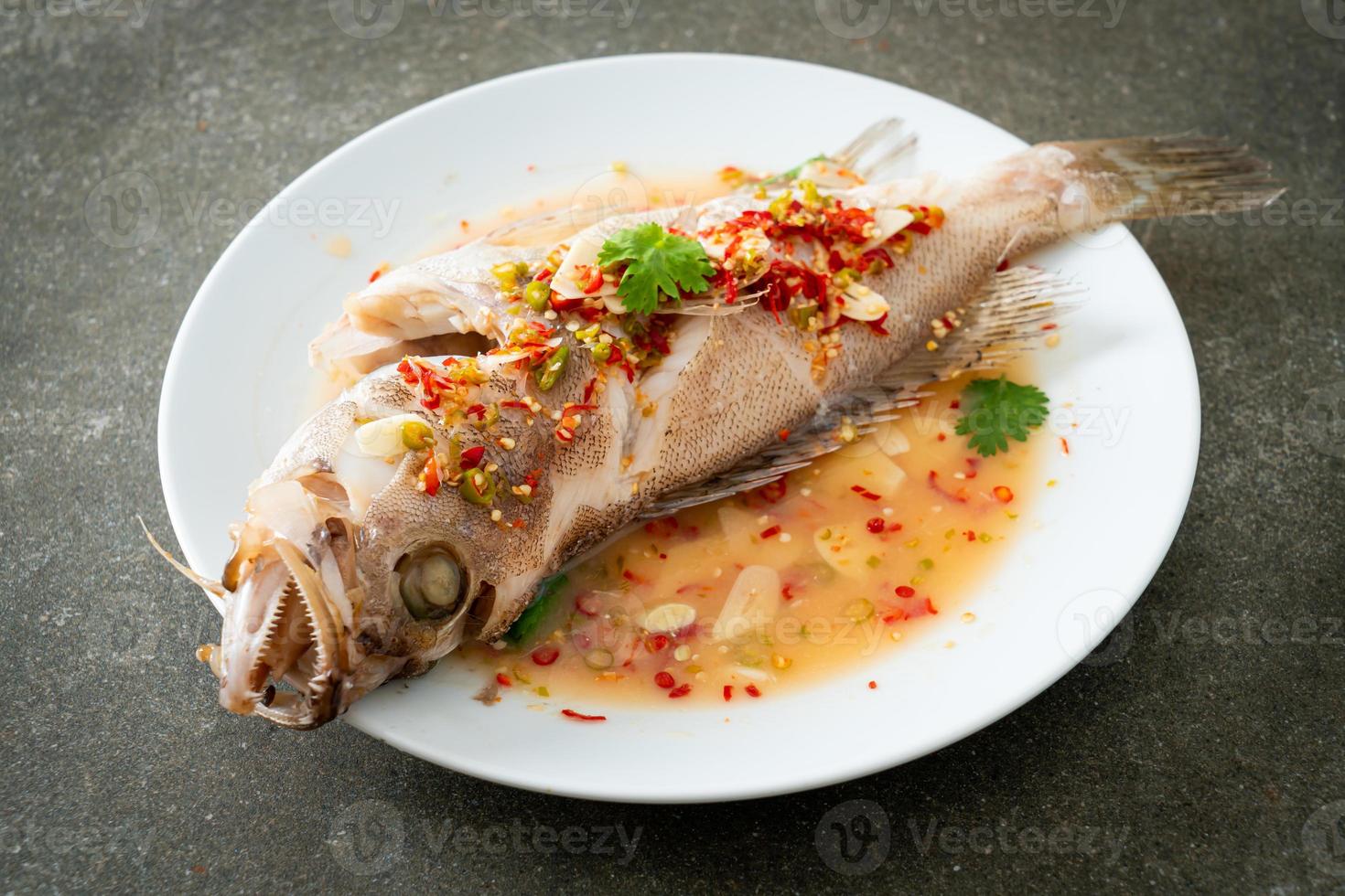 Steamed grouper fish with lime and chillies photo