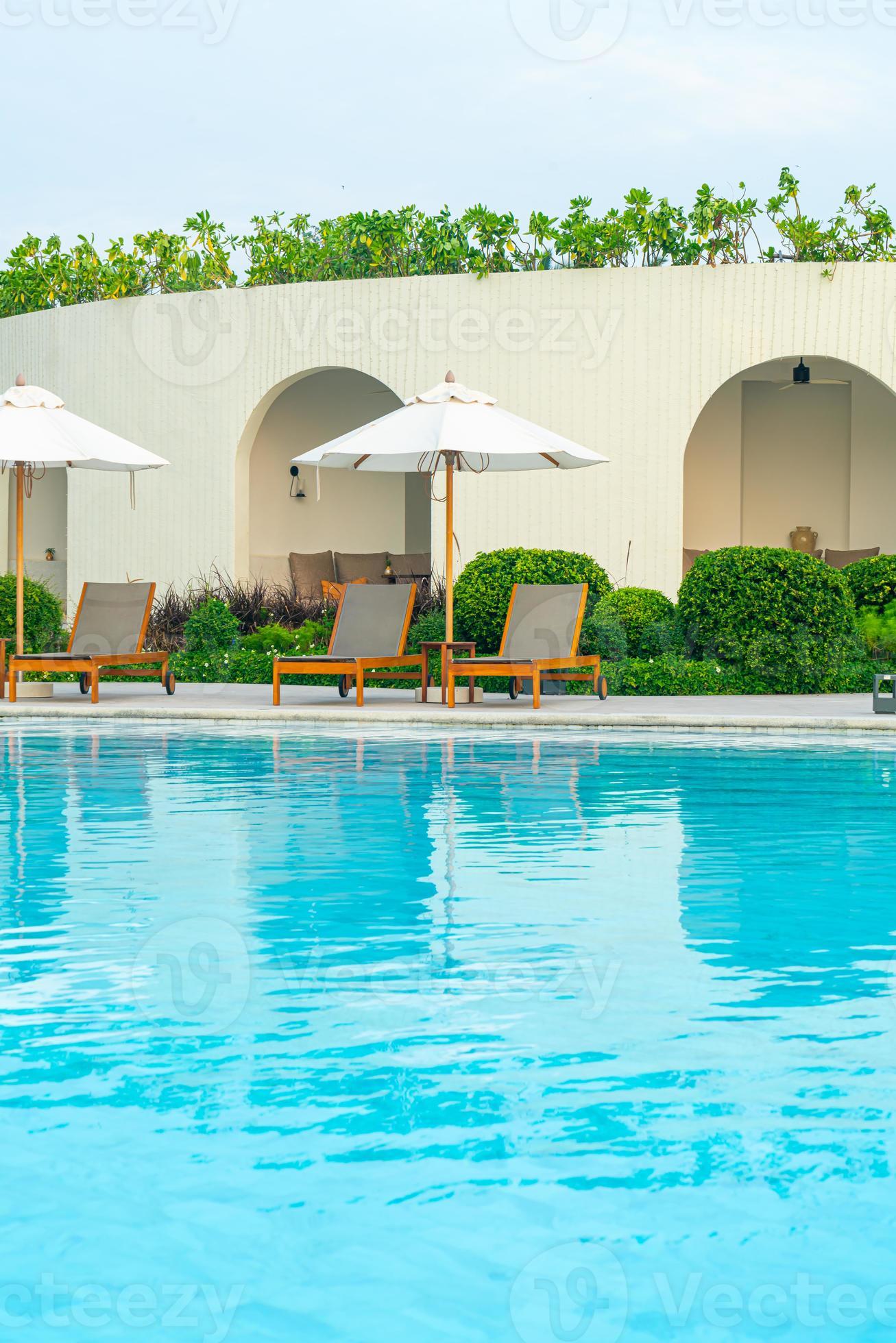 umbrella with bed pool around swimming pool with ocean sea background