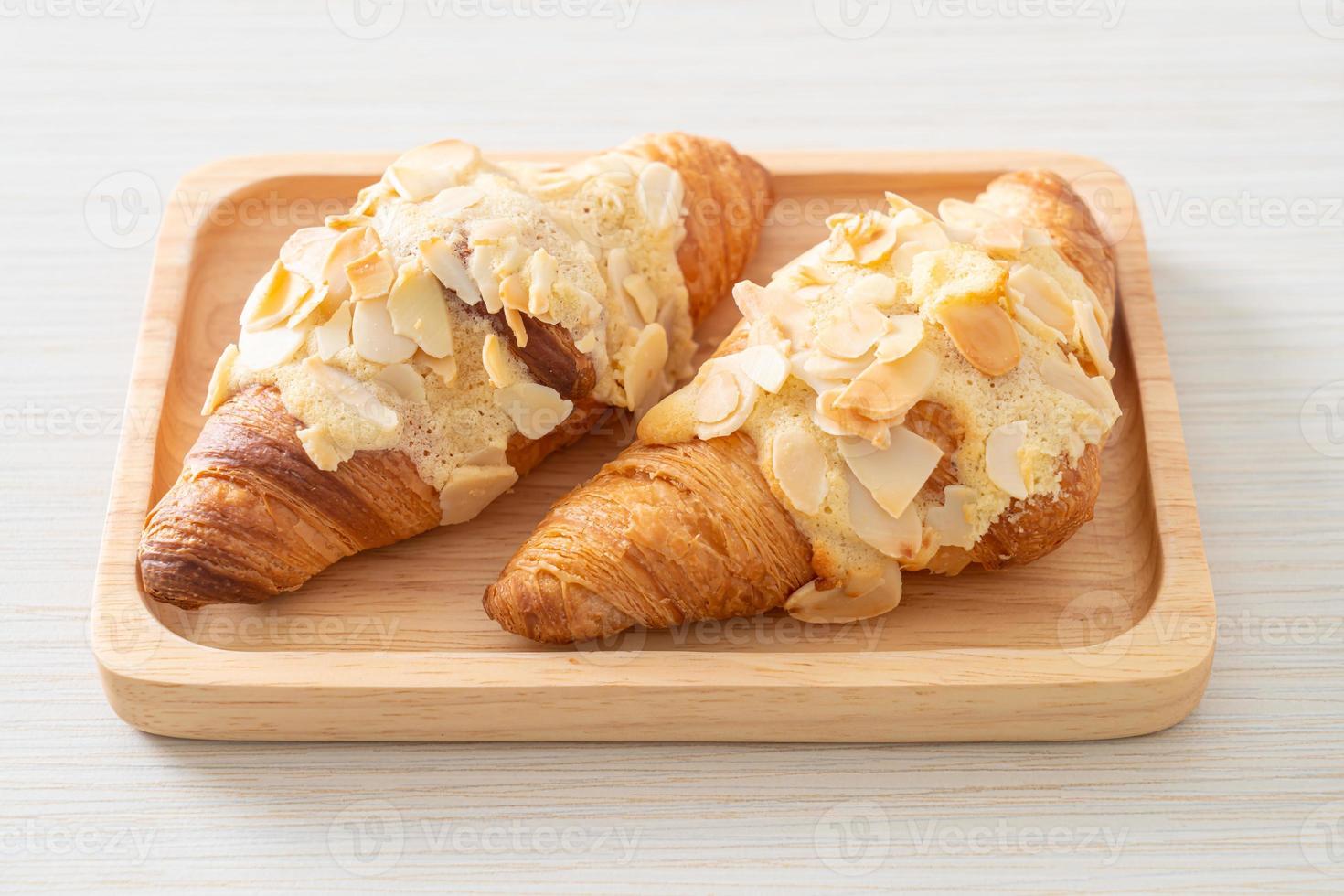 croissant with cream and almonds photo