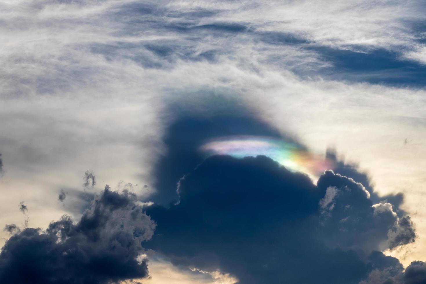 Cloudy with rainbow light hiding. photo