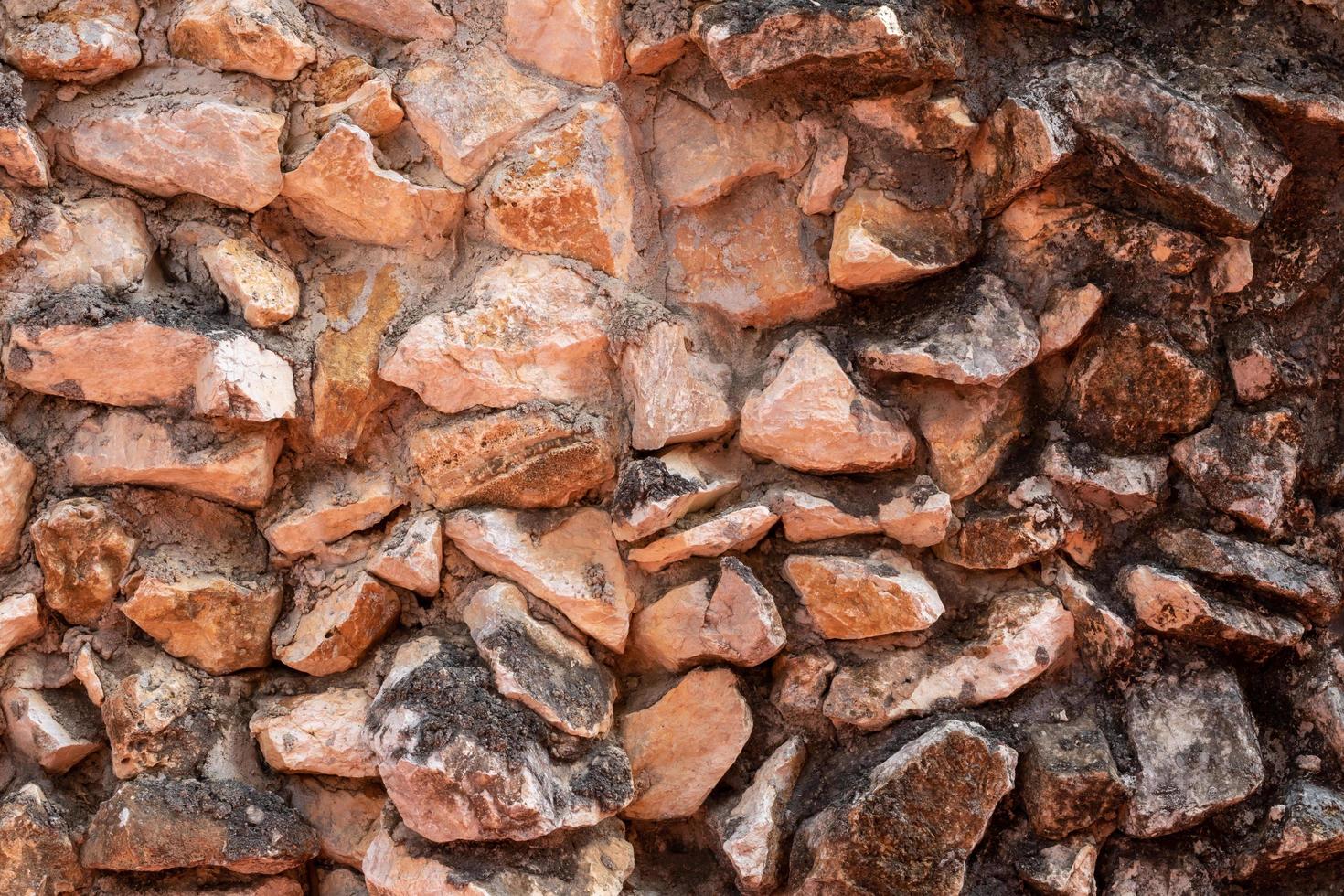 Numerous rugged granite walls with cement. photo