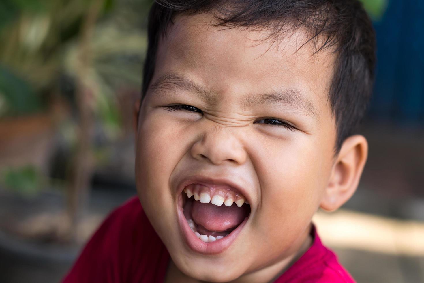 Thai boy open mouth. photo