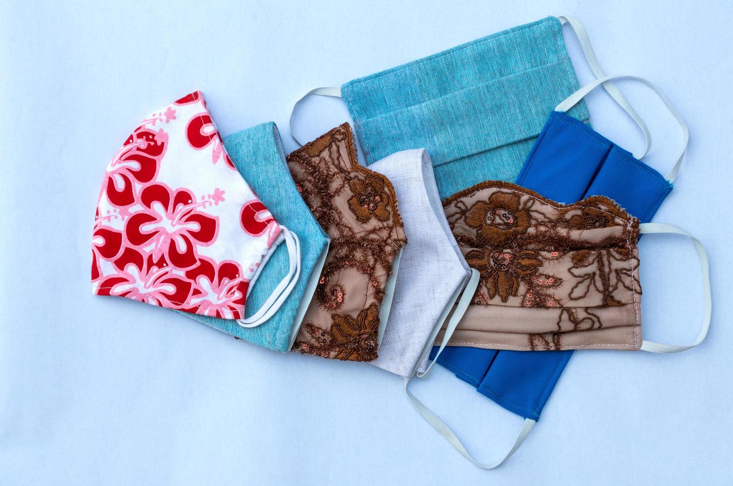 Many cloth masks with colorful patterns. photo