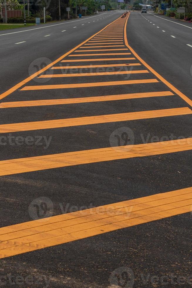 Yellow line in the middle of the paved road. photo