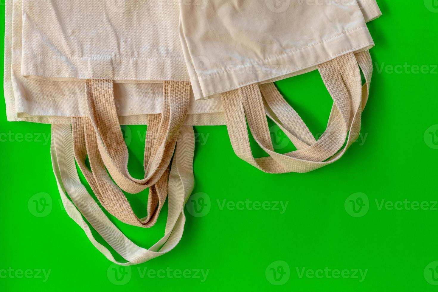 Many cloth bags on the green scene. photo