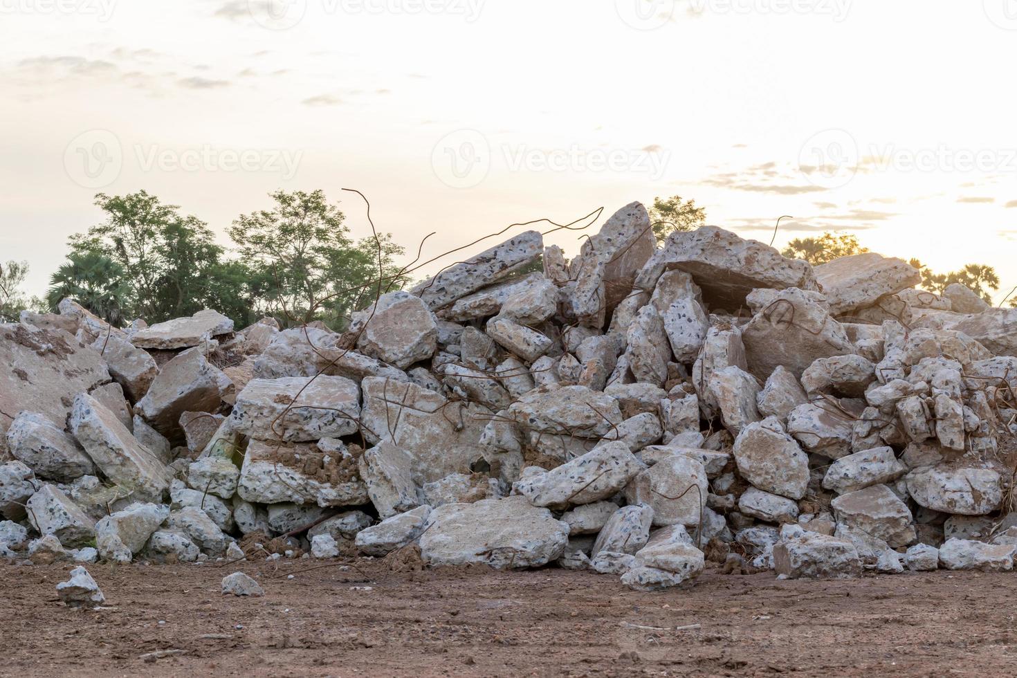 Concrete debris piles on the floor and morning light. photo