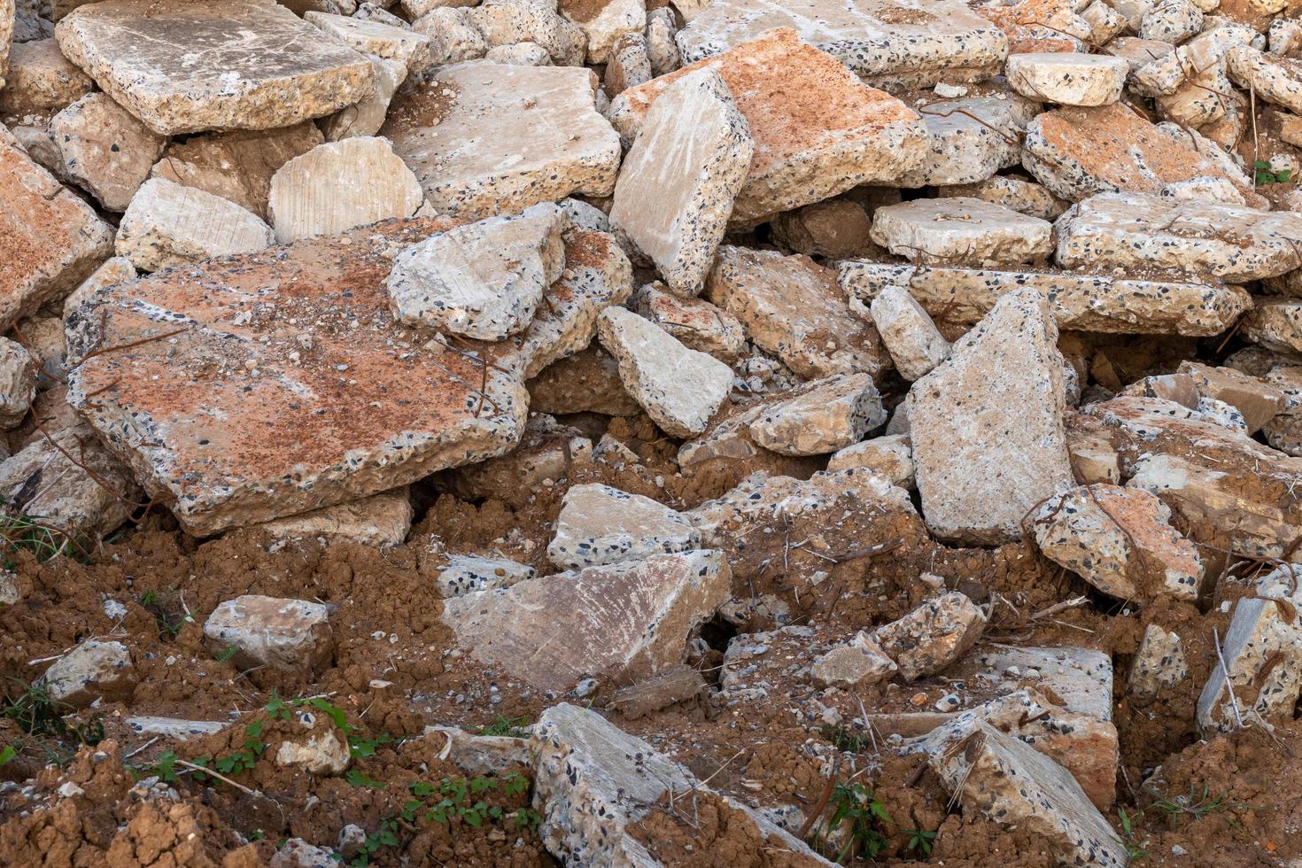 Background of concrete debris piles on the ground. photo