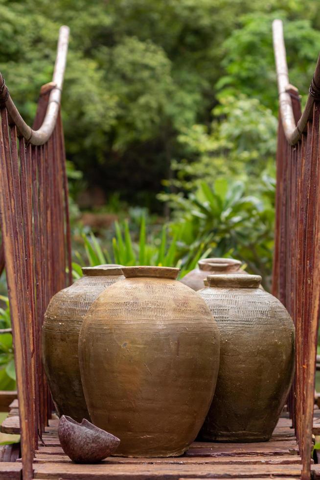 Many jars on the old wooden wagon. photo