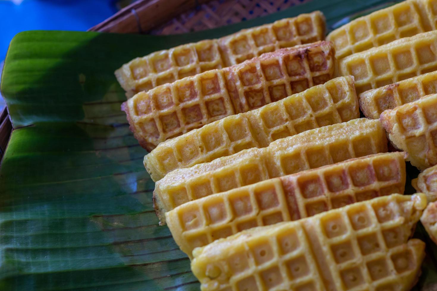 Many honeycomb sweets are placed on banana leaves. photo