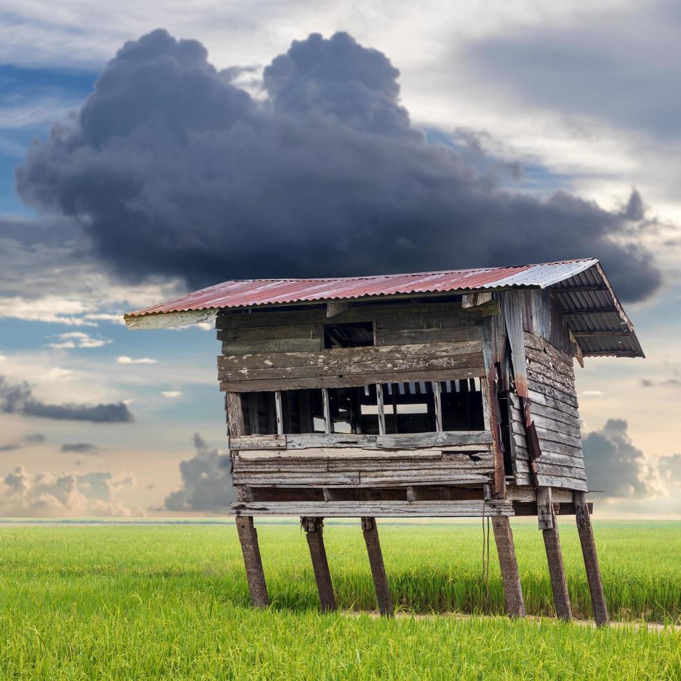 Old wooden hut and cloudy. photo