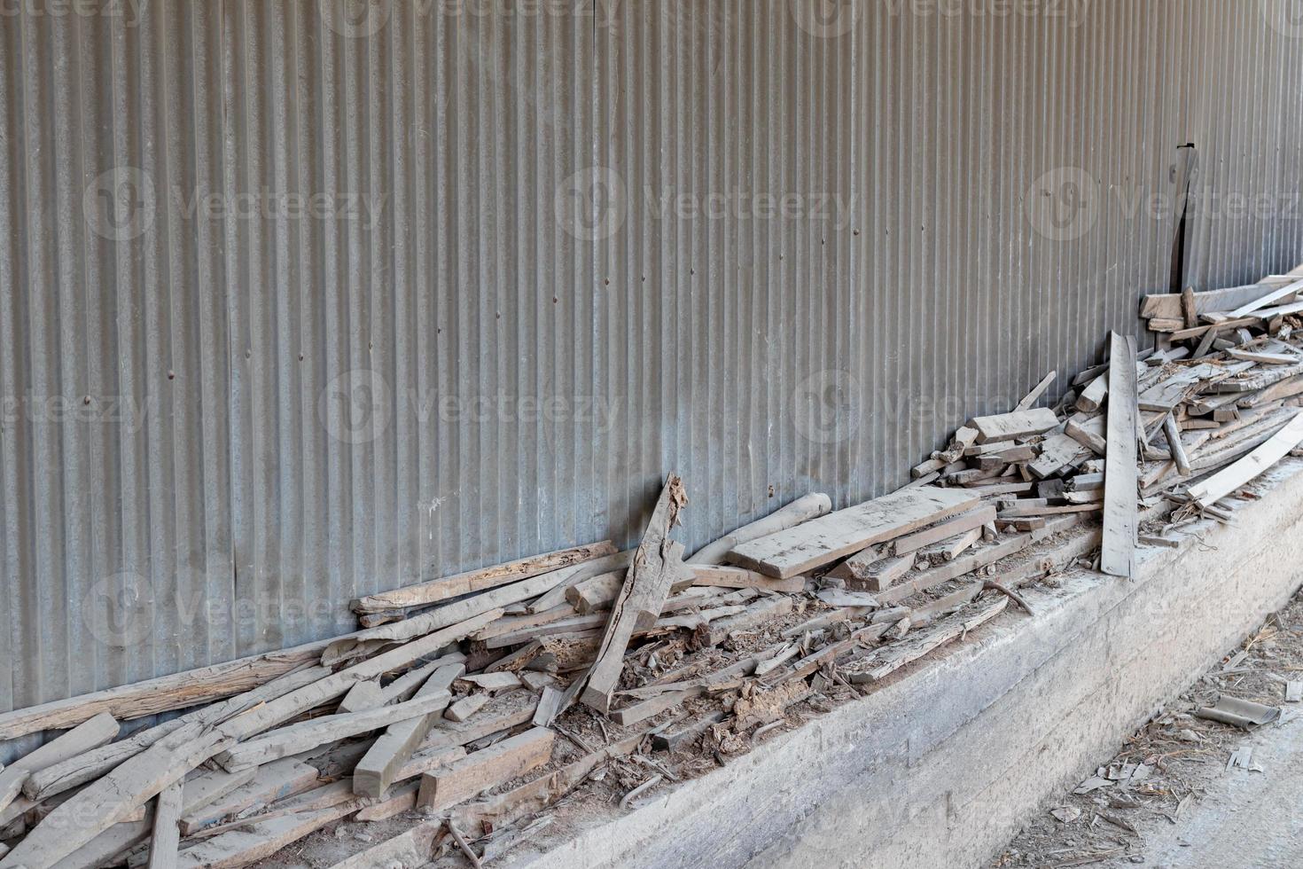 Zinc wall and old wooden remains. photo