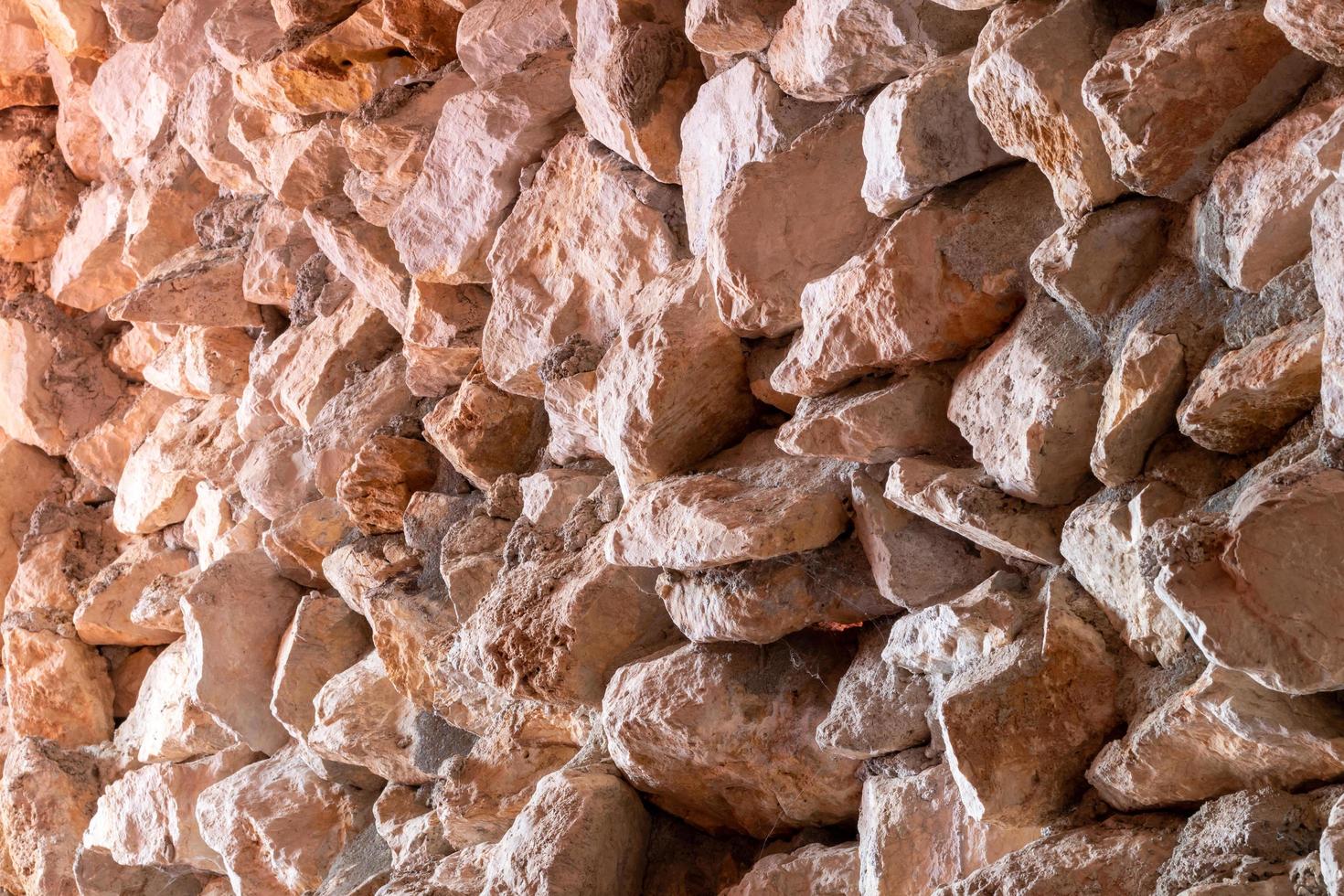 Numerous rugged granite walls with cement. photo