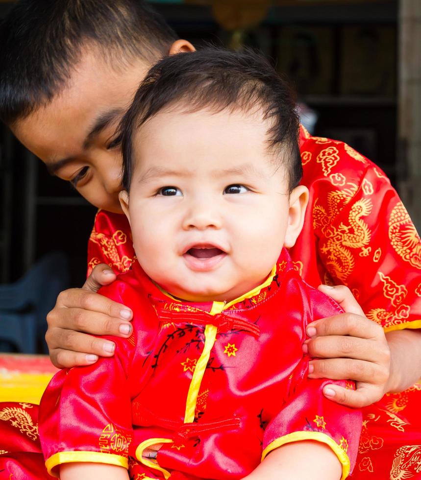 Brother wearing red shirts photo