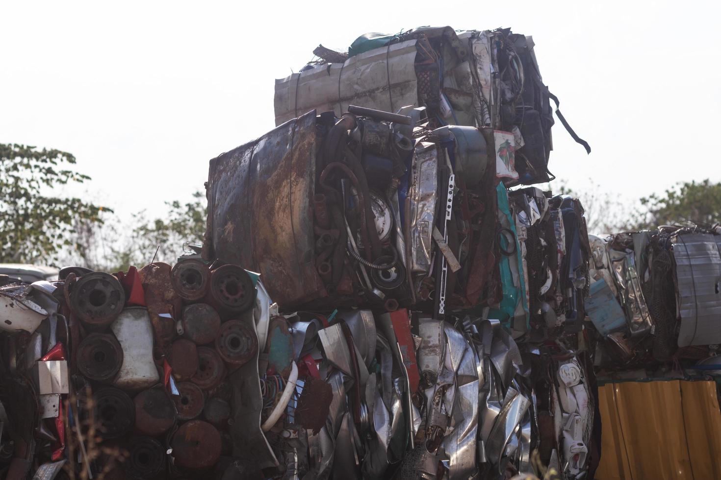 Steel scraps compressed into cubes, preparing to be recycled. photo