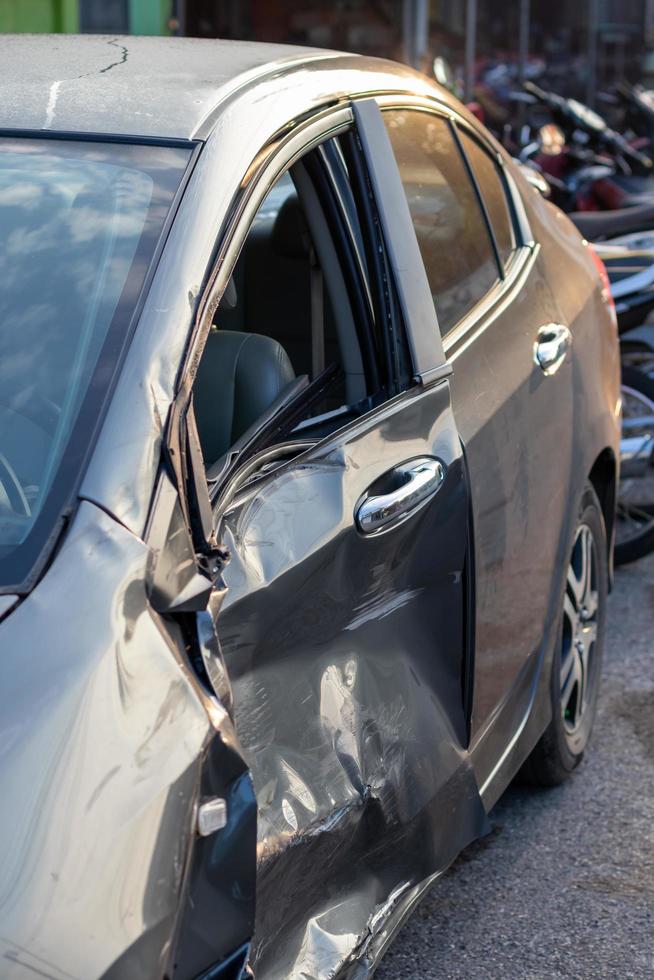 The black car door was completely destroyed. photo