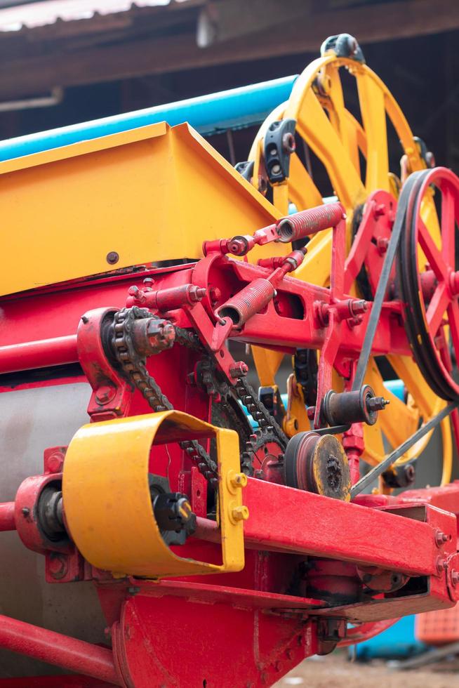 Close-up of the yellow and red combine harvesters. photo