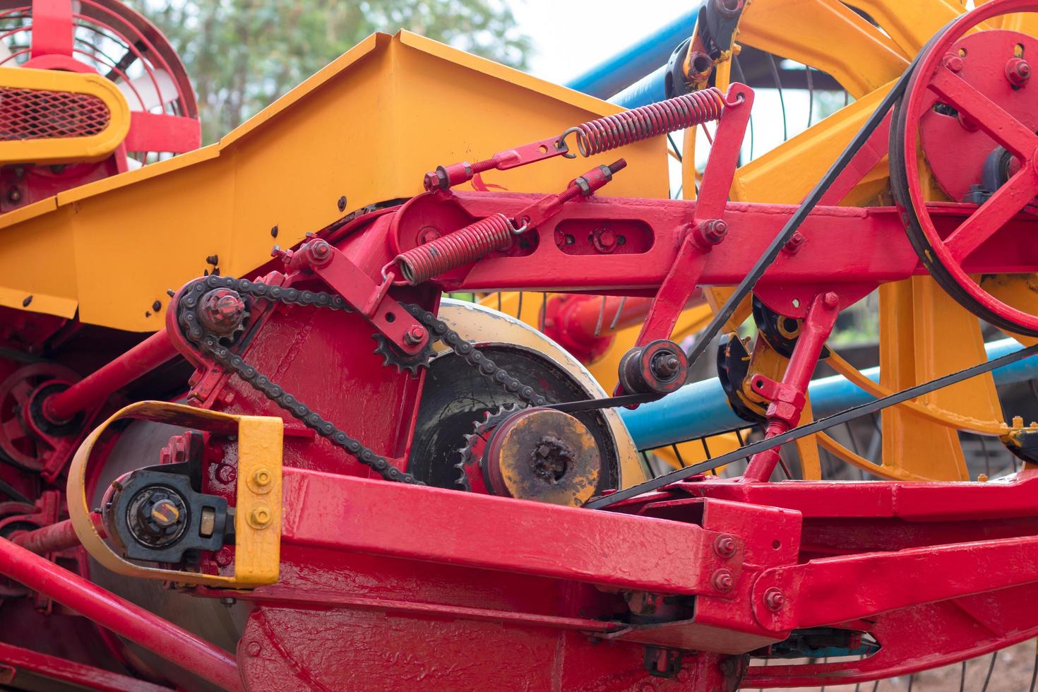Close-up of the yellow and red combine harvesters. photo