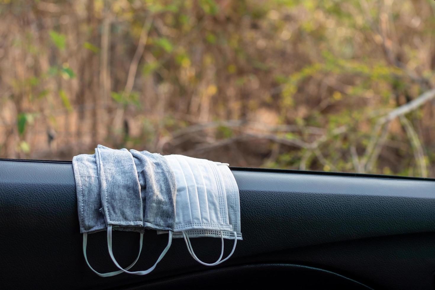 Hygienic masks on the car door. photo