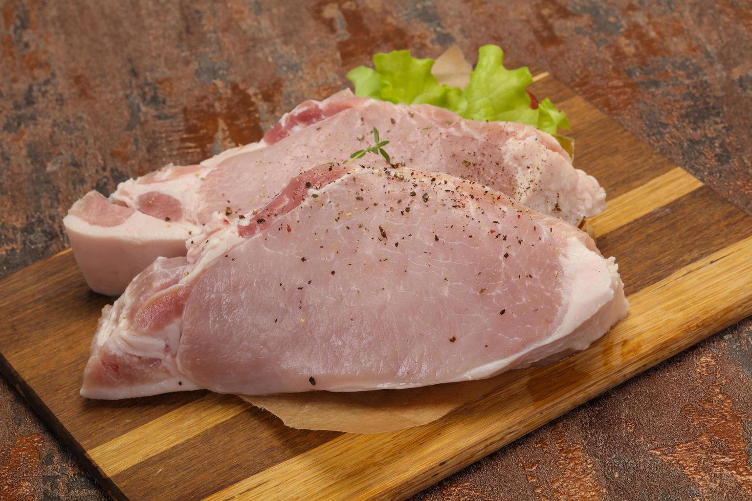 Raw pork meat steak for grill photo