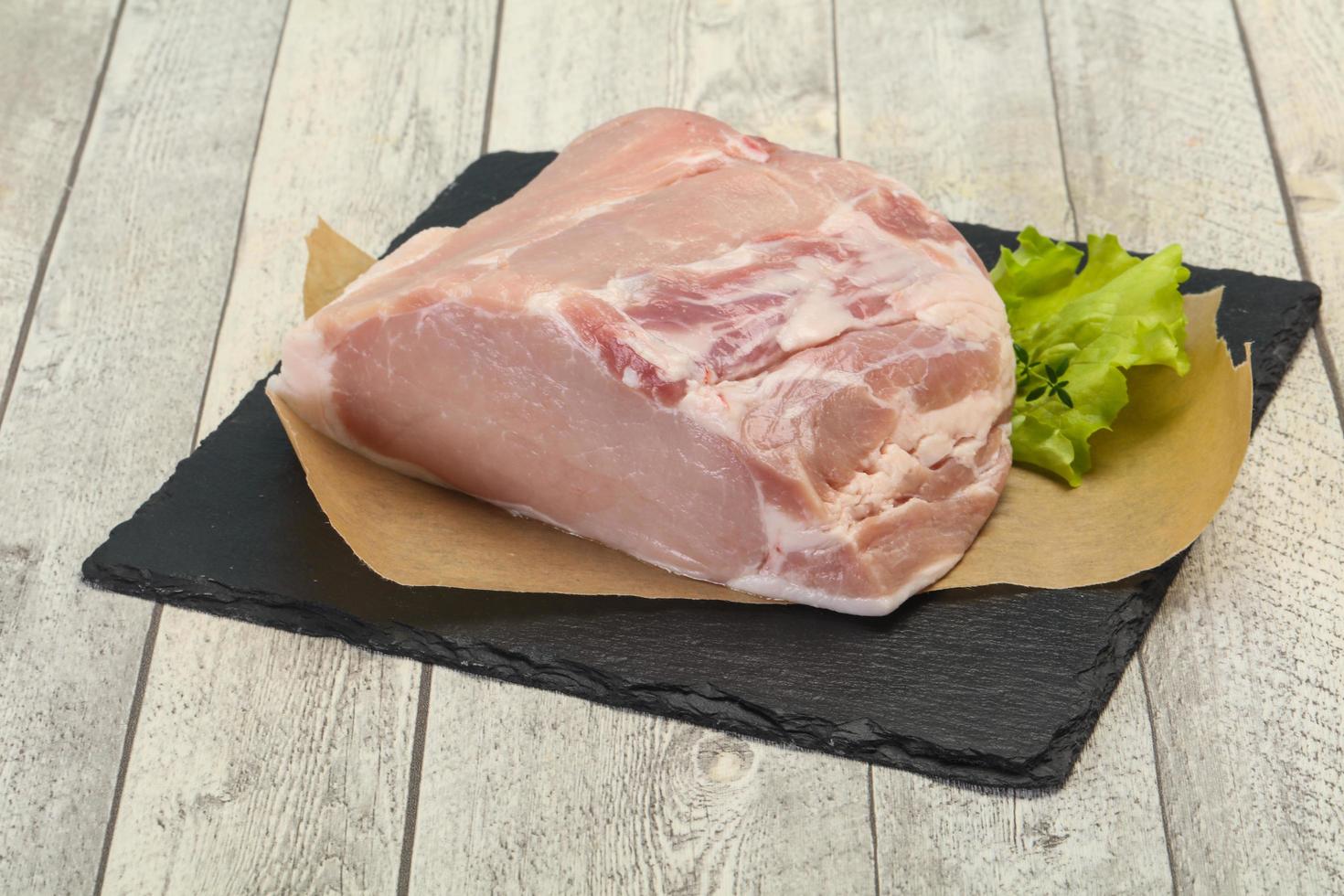 Raw pork meat piece for cooking photo