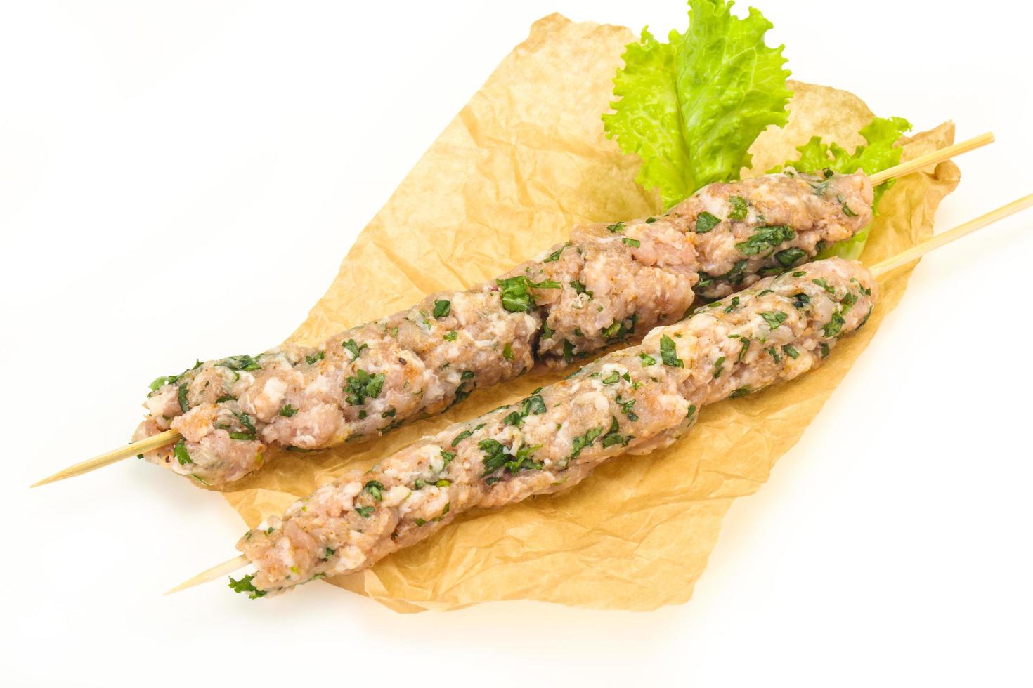 Raw minced pork skewer kebab for grill photo