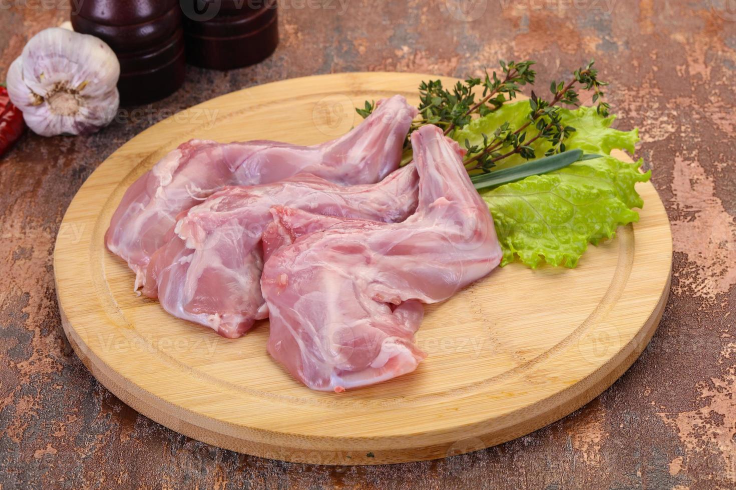 Raw rabbit legs photo