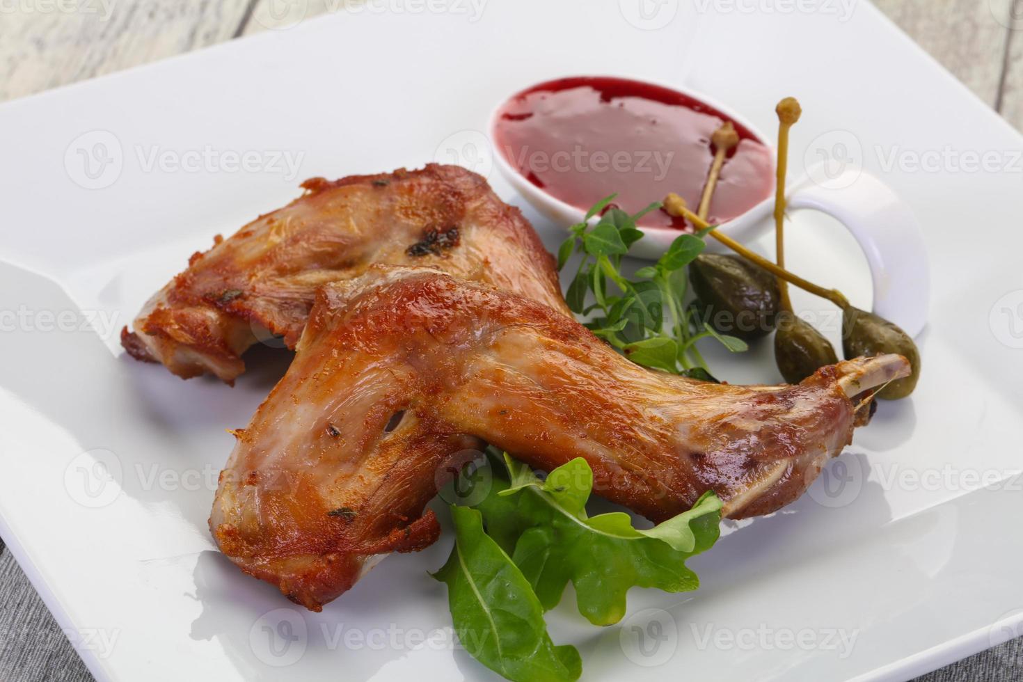 Roasted rabbit legs photo