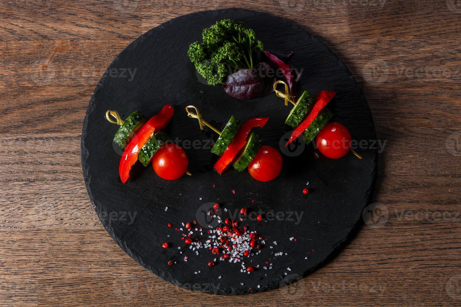 Canape with tomato and cucumber photo