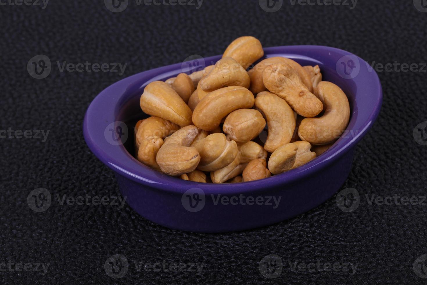 Cashew nuts heap in the bowl photo