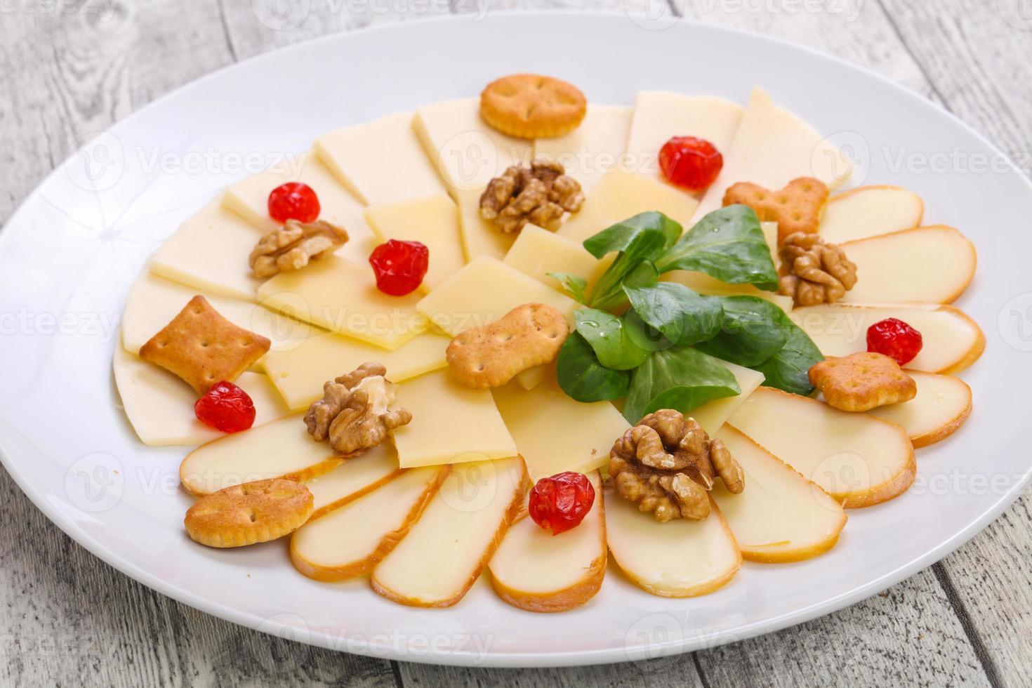 Cheese plate with nuts photo