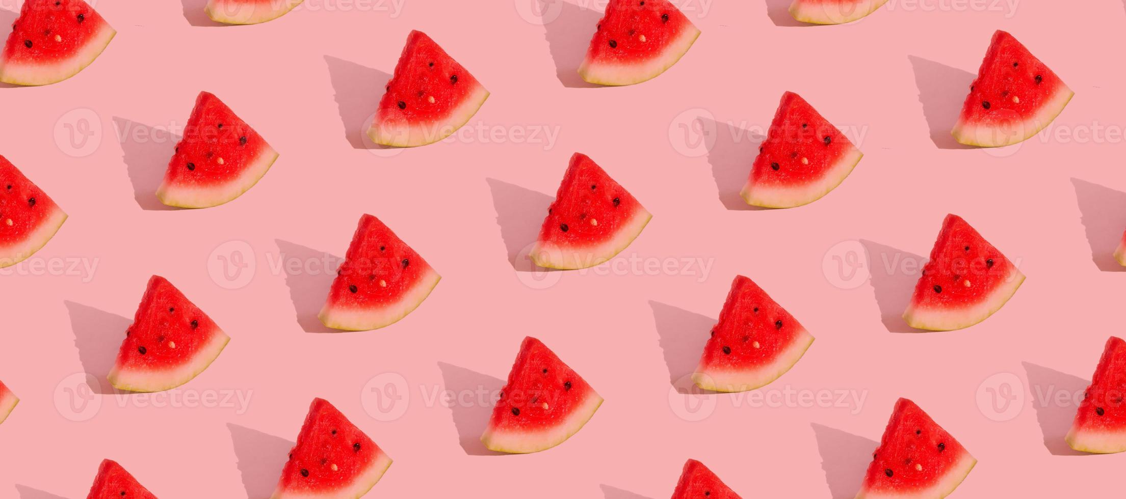 Pattern with watermelon slices isolated on pink.Abstract summer background. Banner format photo
