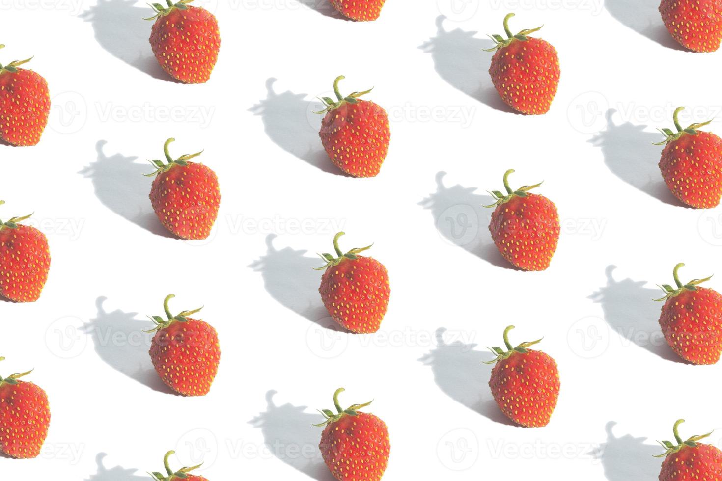 Pattern with strawberries isolated on white. Abstract summer background photo