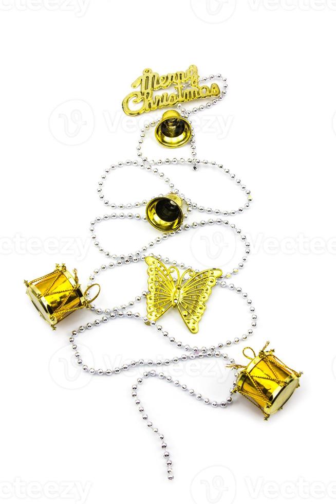 Christmas tree made from golden winter decorations on white background with empty copy space for text. holiday and celebration creative concept. top view photo