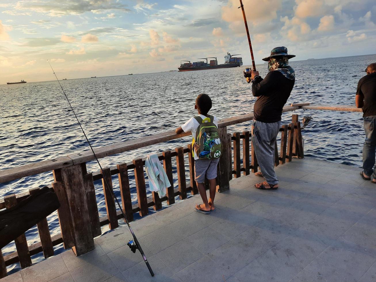 Male, Maldives, April 2021-People fishing on the beach photo