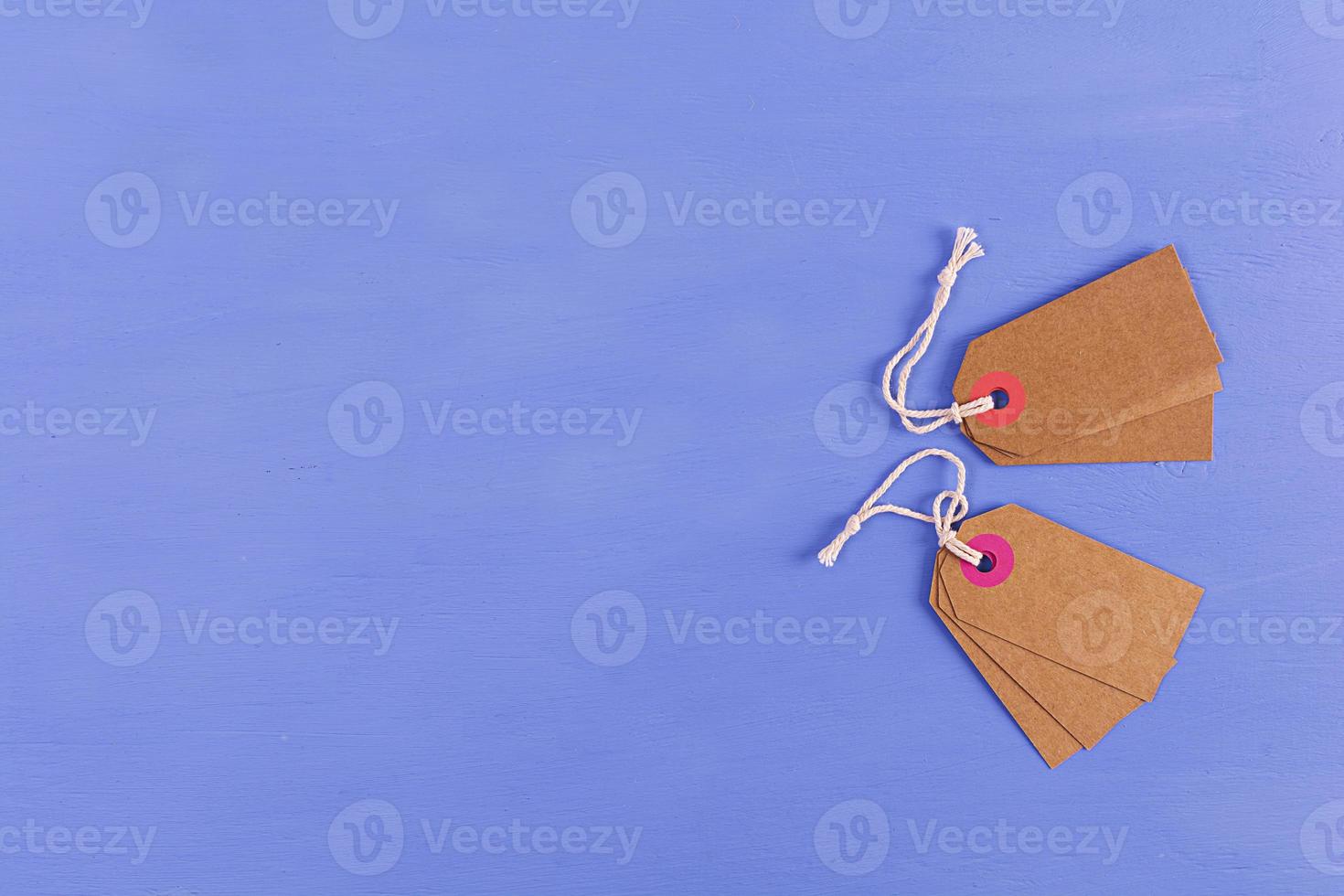 Blank label tag isolated on blue background. Price tag. Sale concept. photo