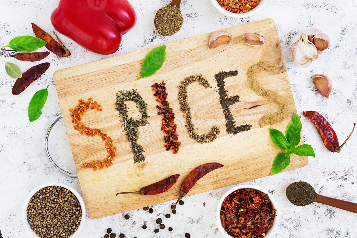 Different spices on white background. Top view photo