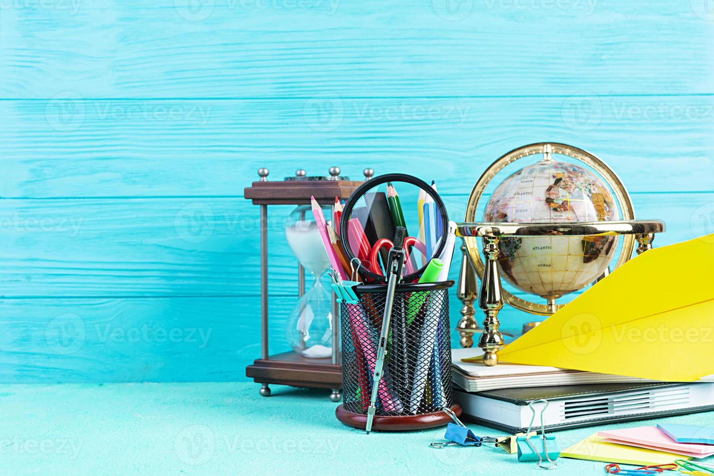 Different school supplies on blue background. Concept Back to school photo