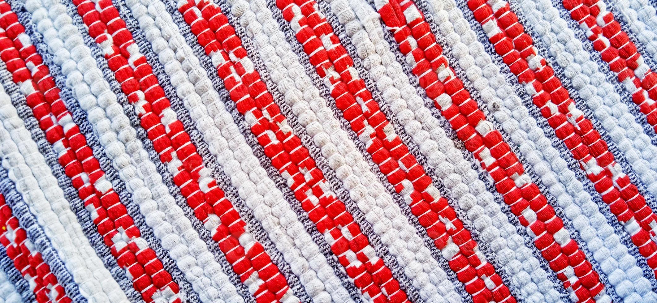 Stripe fabric carpet texture red, dark gray and white colors. photo
