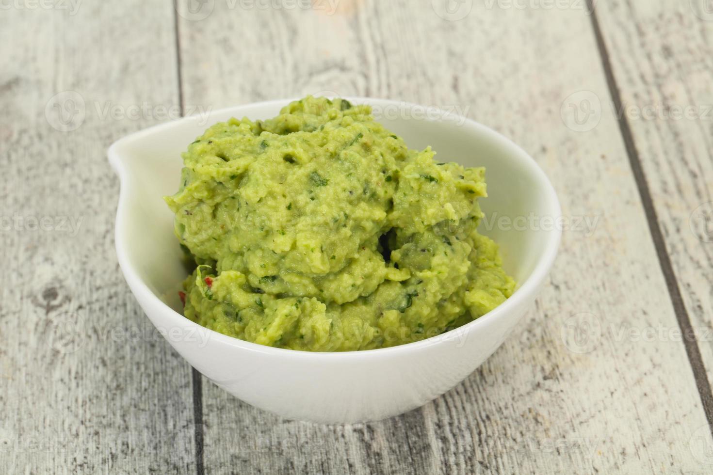 Avocado guacamole sauce with chili pepper photo