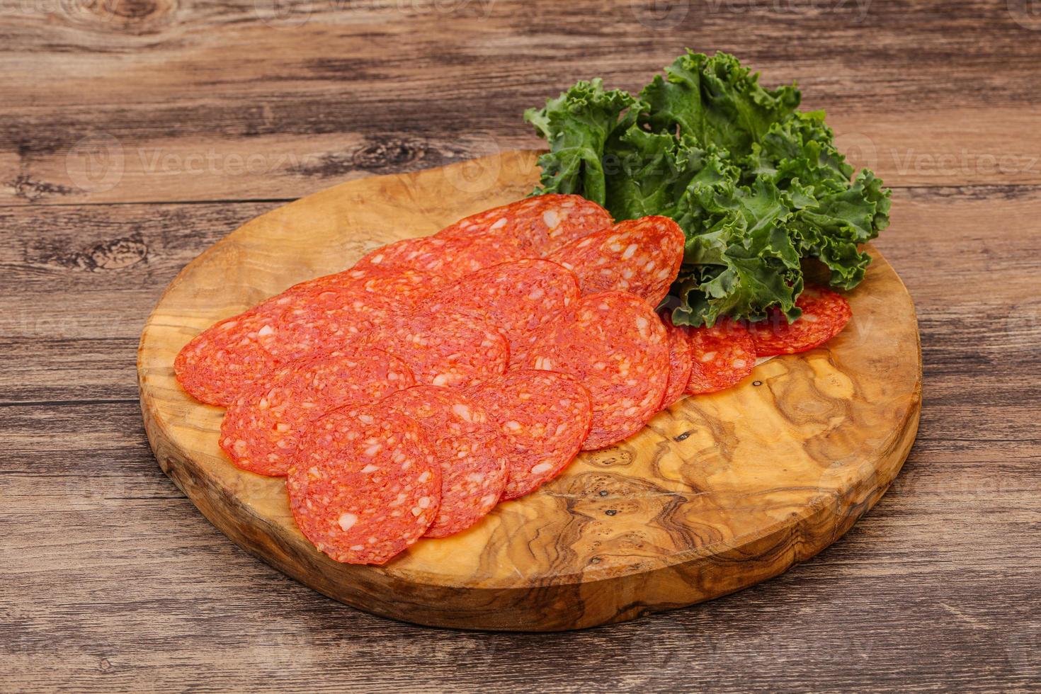 Italian spycy pepperoni sausage slices photo