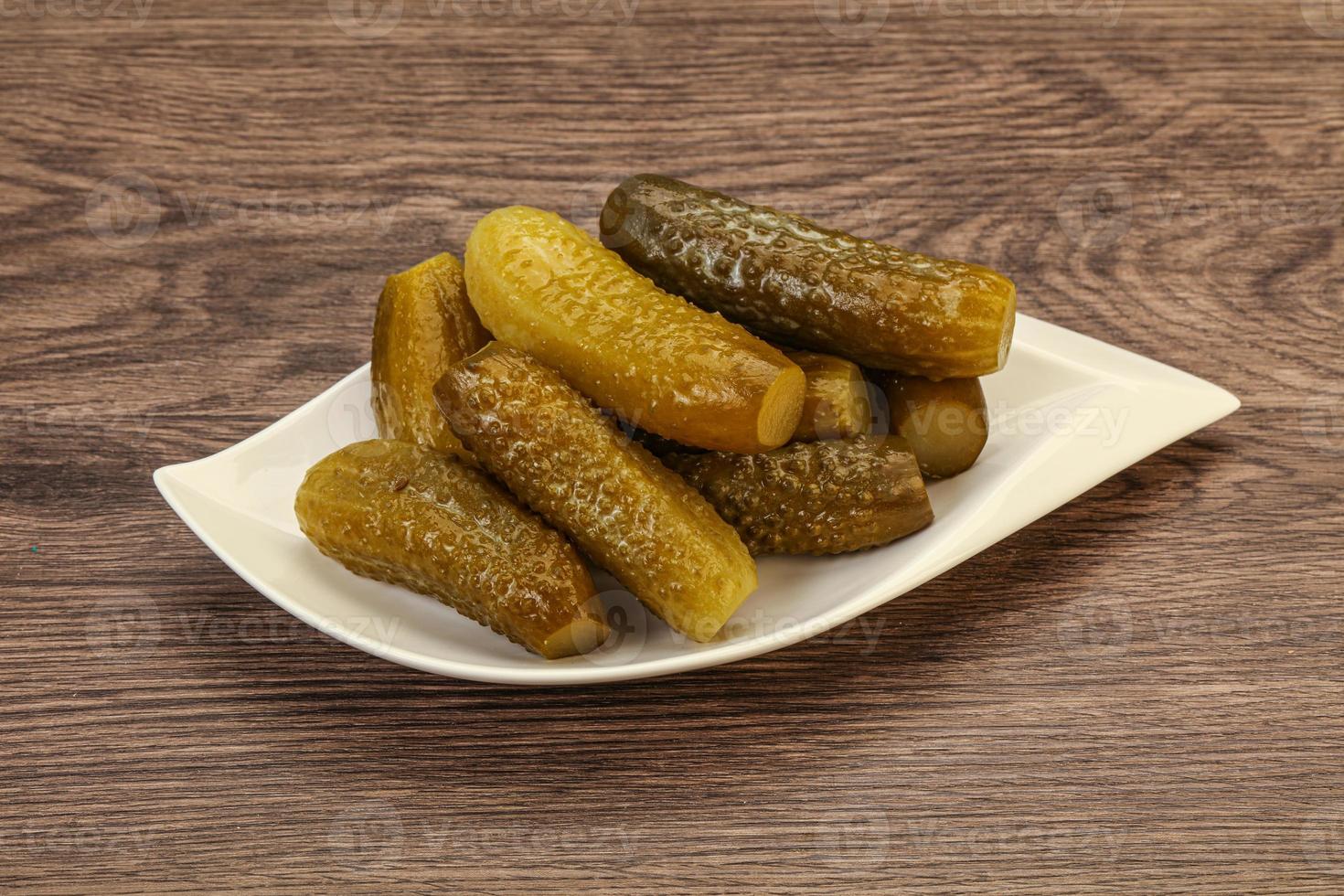 Pickled cucumbers in the plate photo