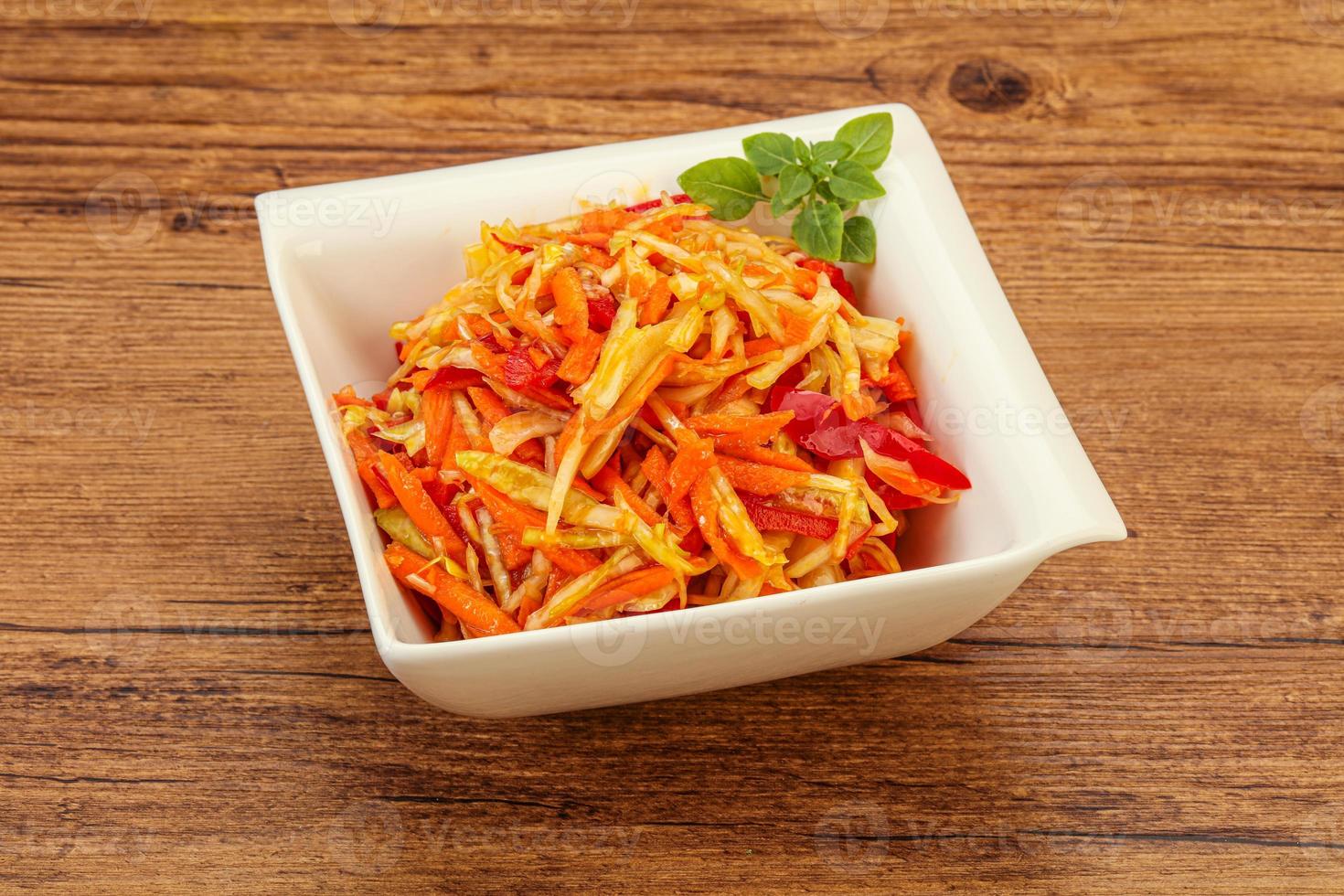 Cabbage salad with carrot and pepper photo