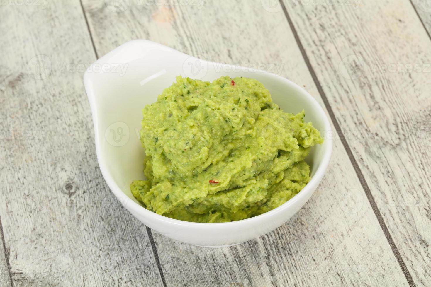 Avocado guacamole sauce with chili pepper photo