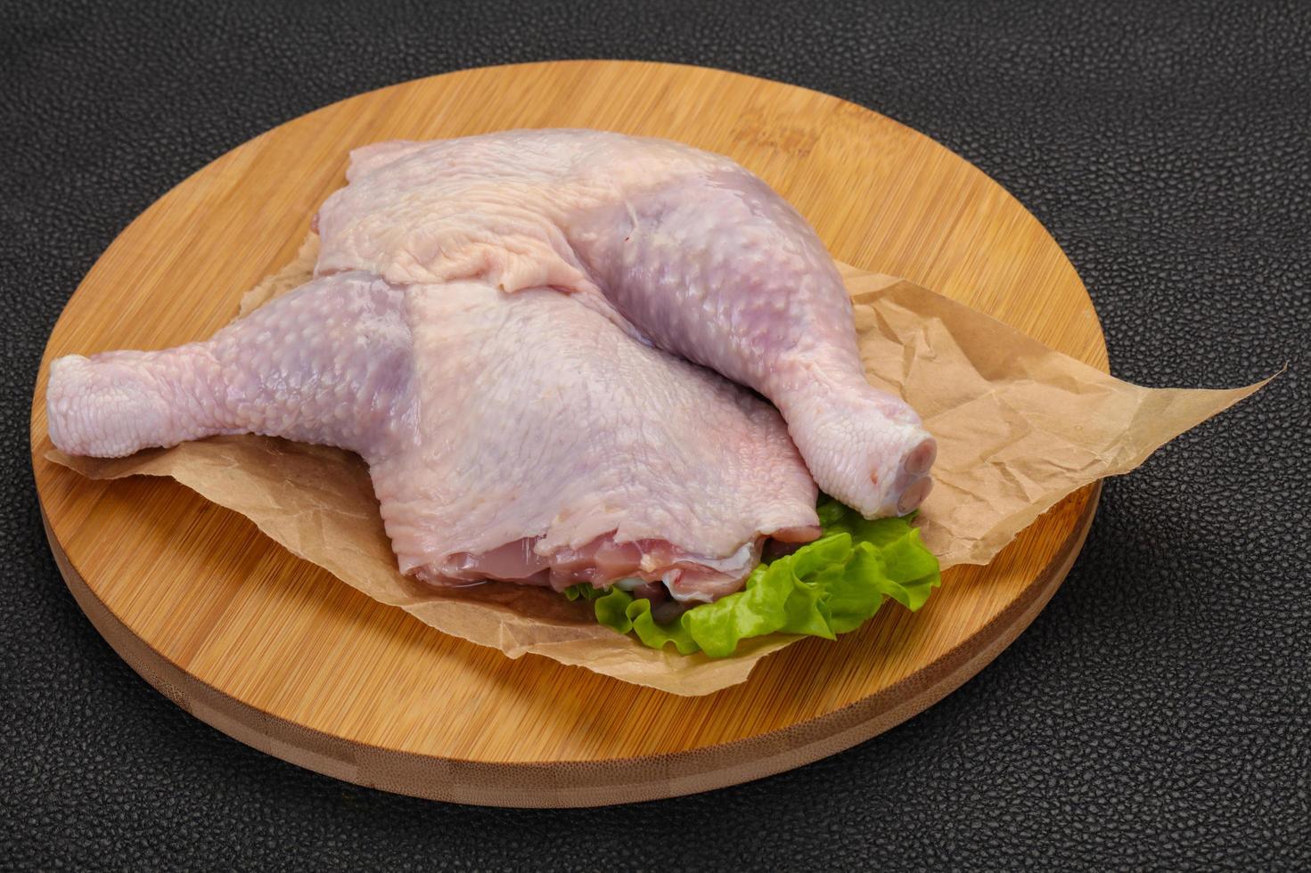 Raw chicken leg photo