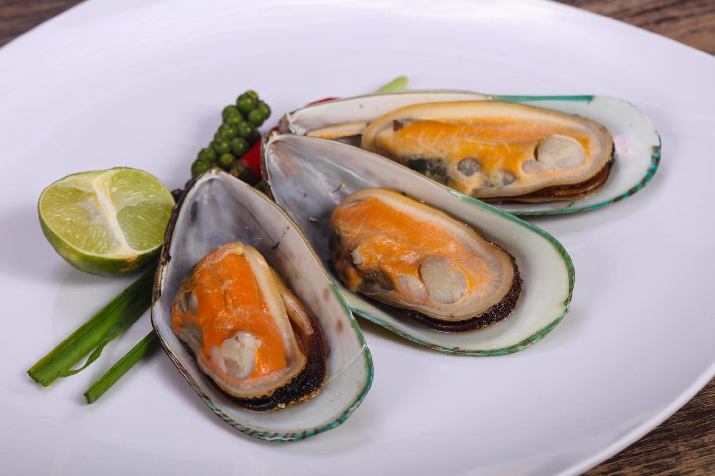 Half mussels with lime and pepper photo