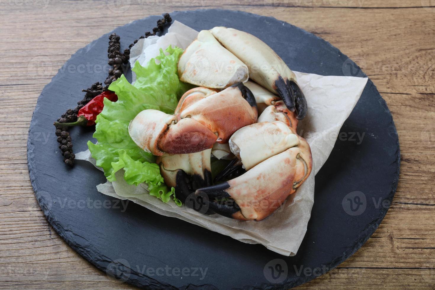 Crab claws on slate photo