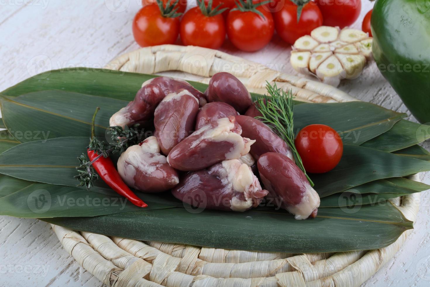 Raw chicken hearts photo