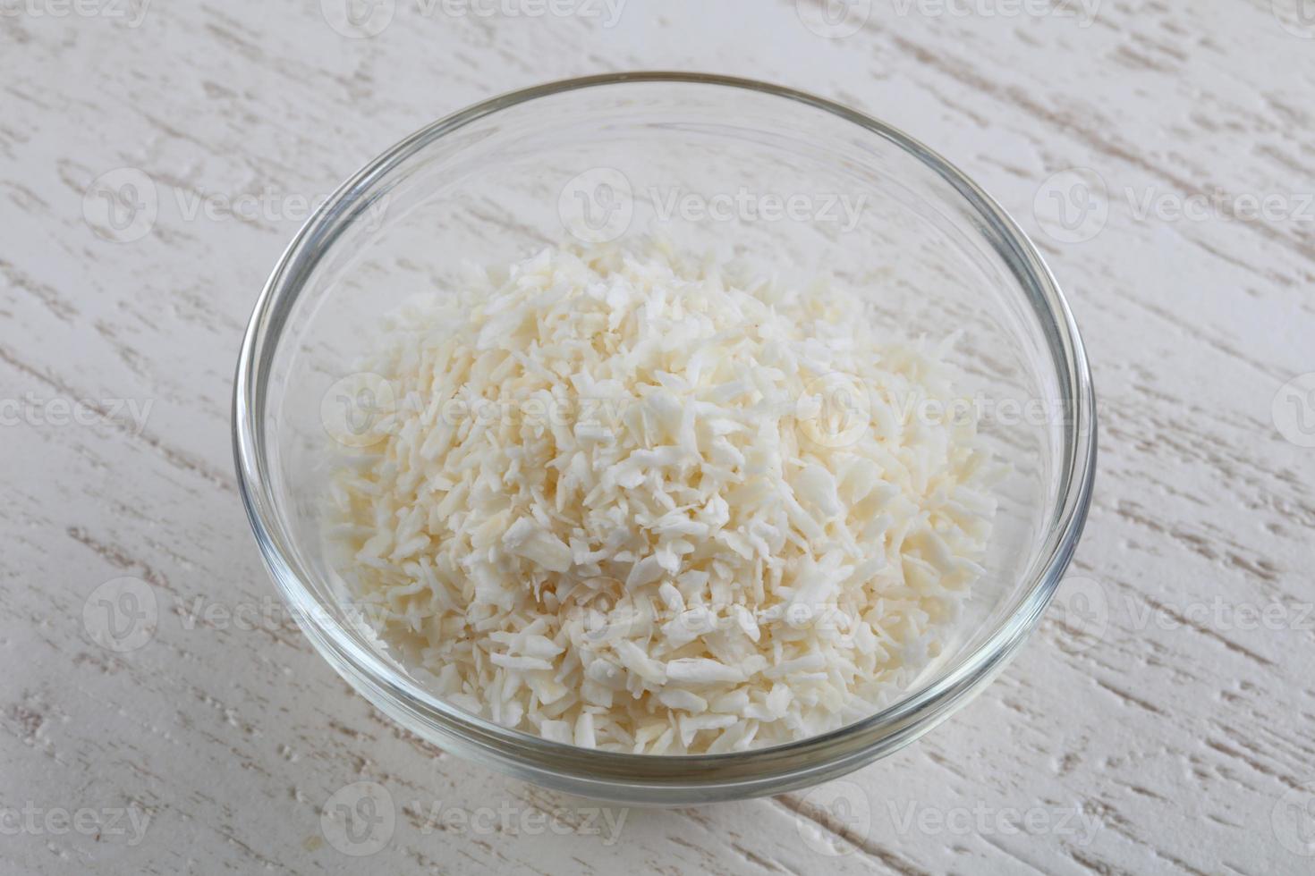 Coconut flakes in bowl photo